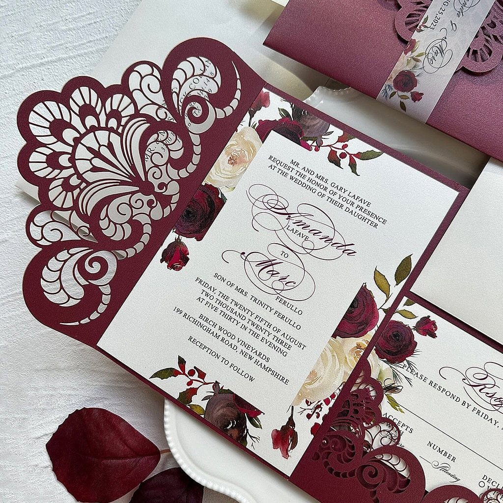 Dark Red Wedding Colors: 20 Ideas for Mood and Palette 18 Laser-cut dark red wedding invitations with cream paper and floral rose illustrations.