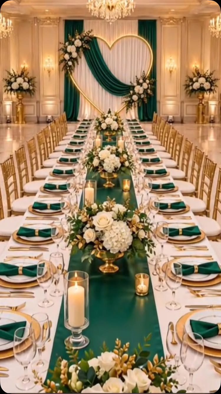 Green Gold White Wedding: 8 Ideas for Decor and Details 1 A long wedding banquet table decorated with emerald green runners, white flowers, and gold accents.